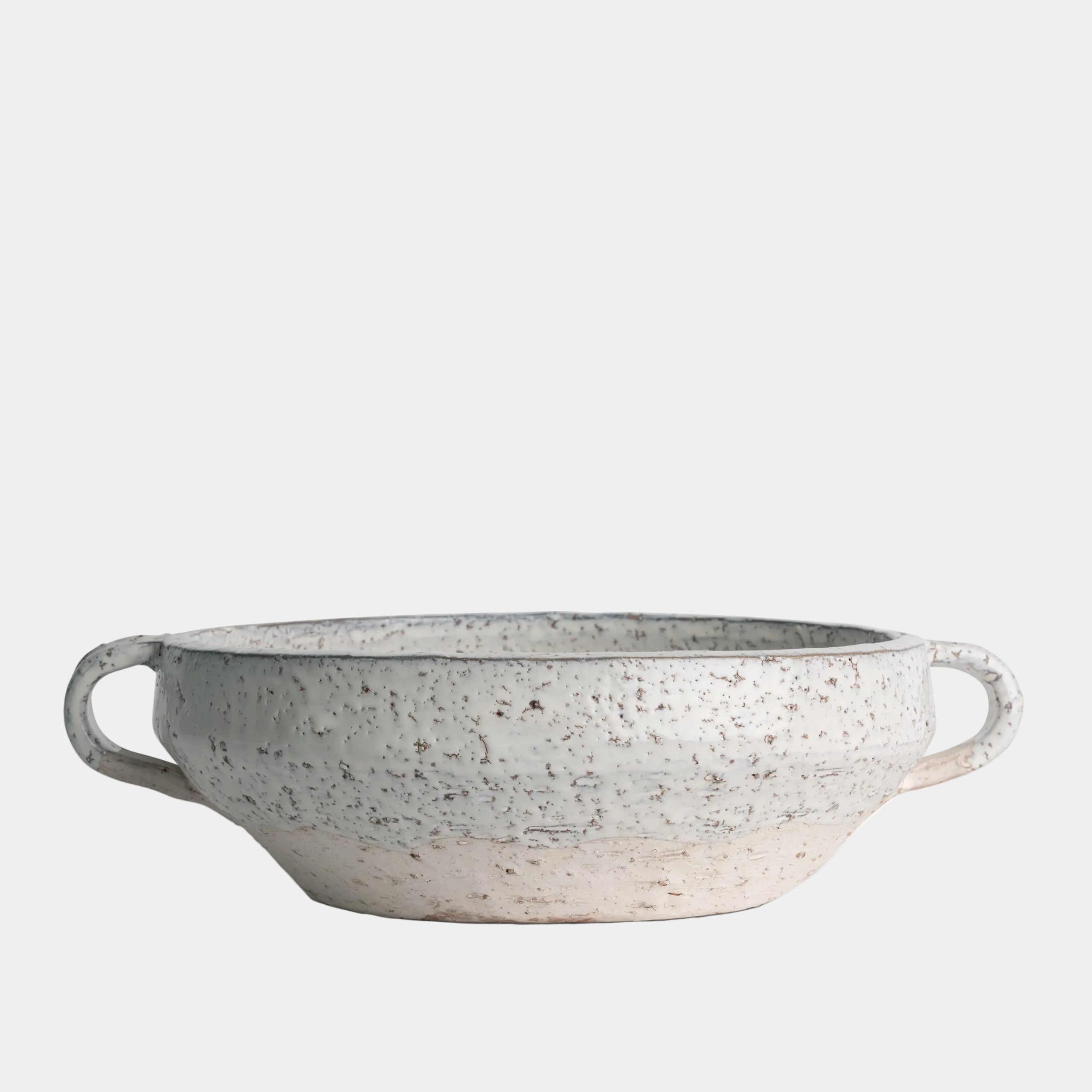 Speckled gray ceramic bowl with handles on a white background