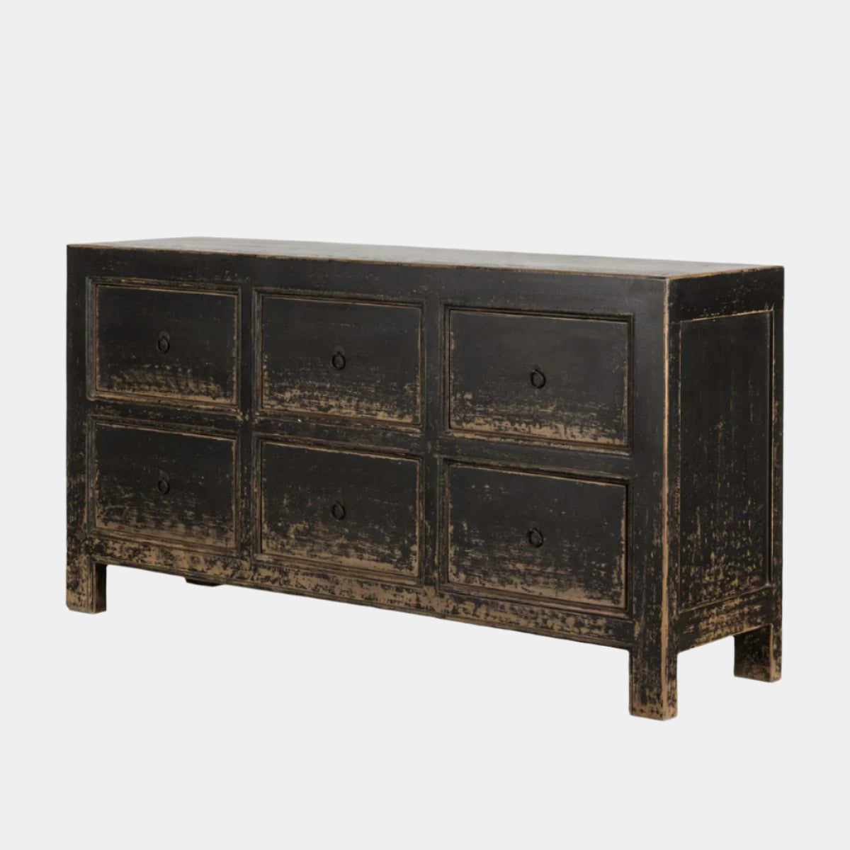 Distressed black dresser with six drawers on a white background