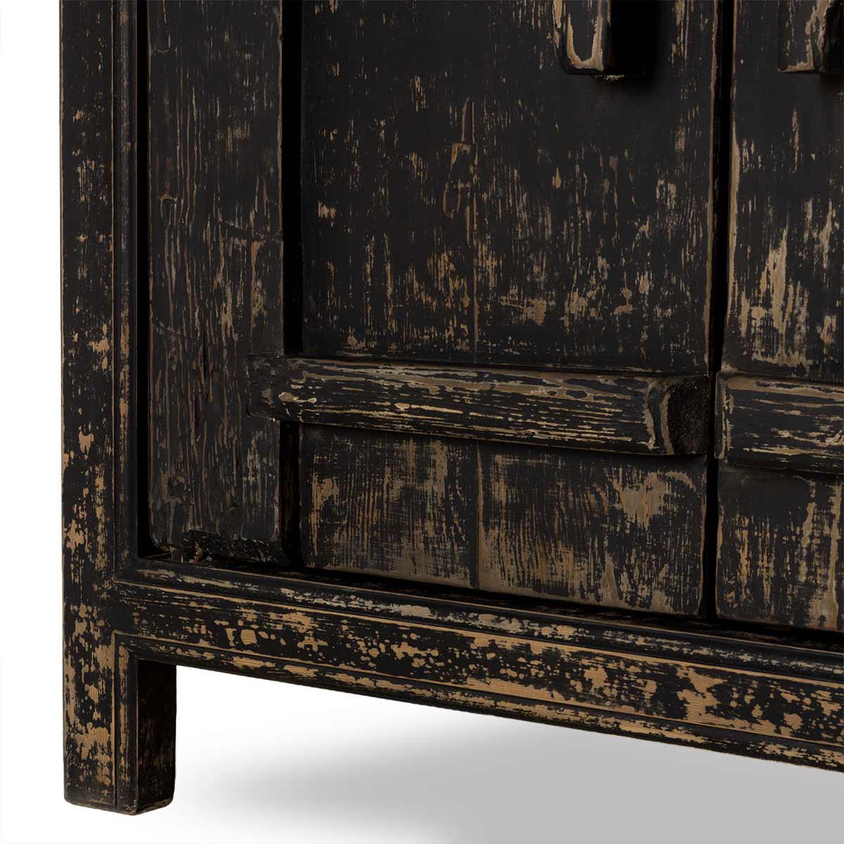 Vintage wooden cabinet with a distressed black finish on a white background