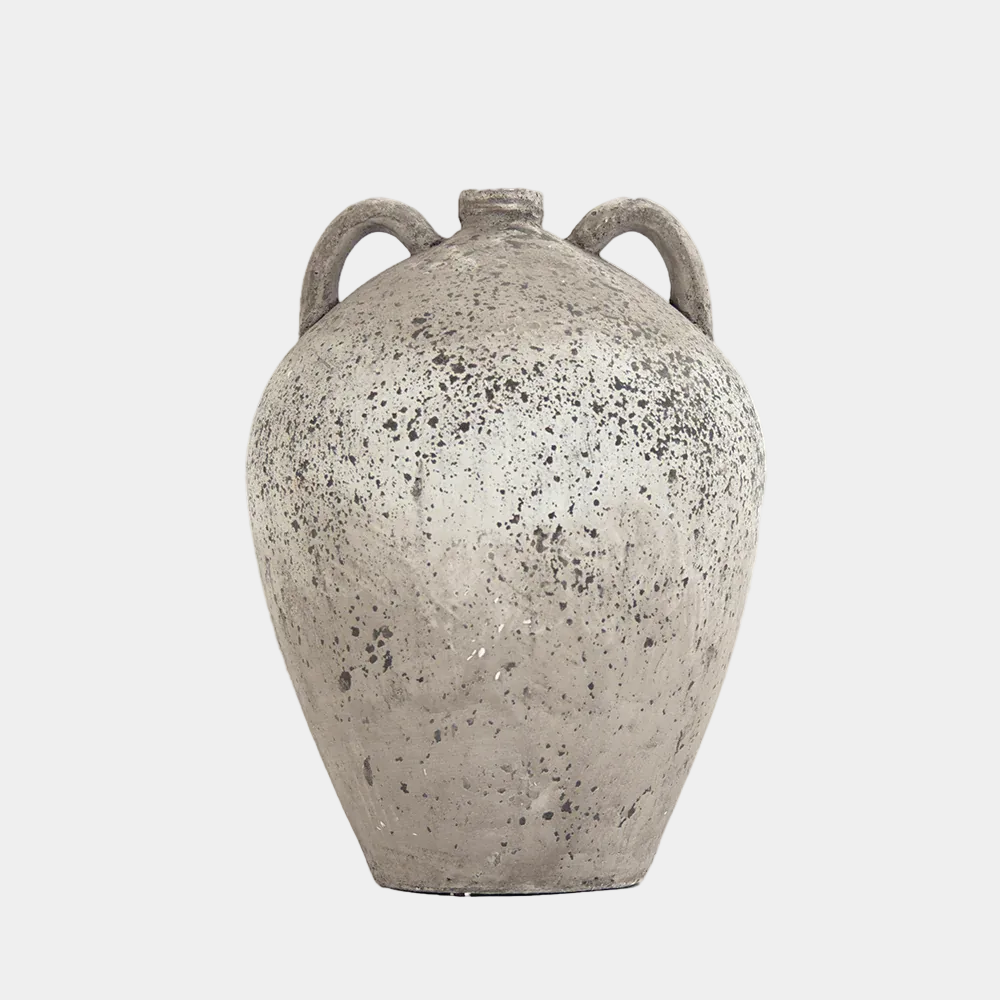 Speckled gray ceramic vase with two handles on a white background