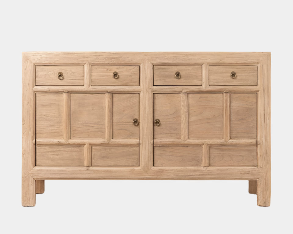 Wooden sideboard with multiple drawers and doors on a light background